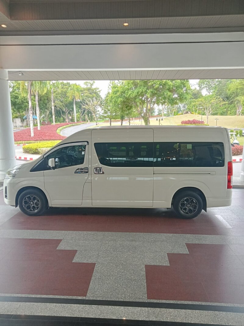 White Toyota HiAce minibus — side profile at a Phuket resort